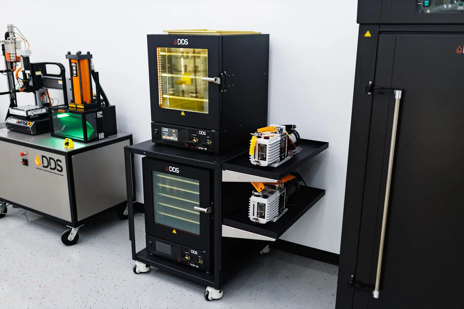 DDS vacuum ovens with vacuum pumps on a mobile cart